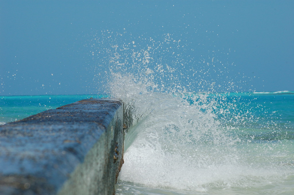 Waves crashing against a sea wall
